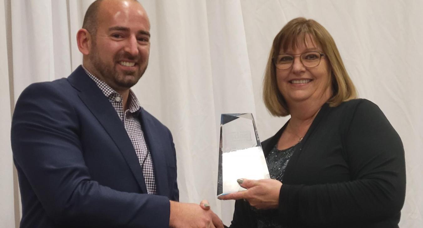Mike Traxinger congratulates Brenda Forman on 25 years as SDAC Executive Director